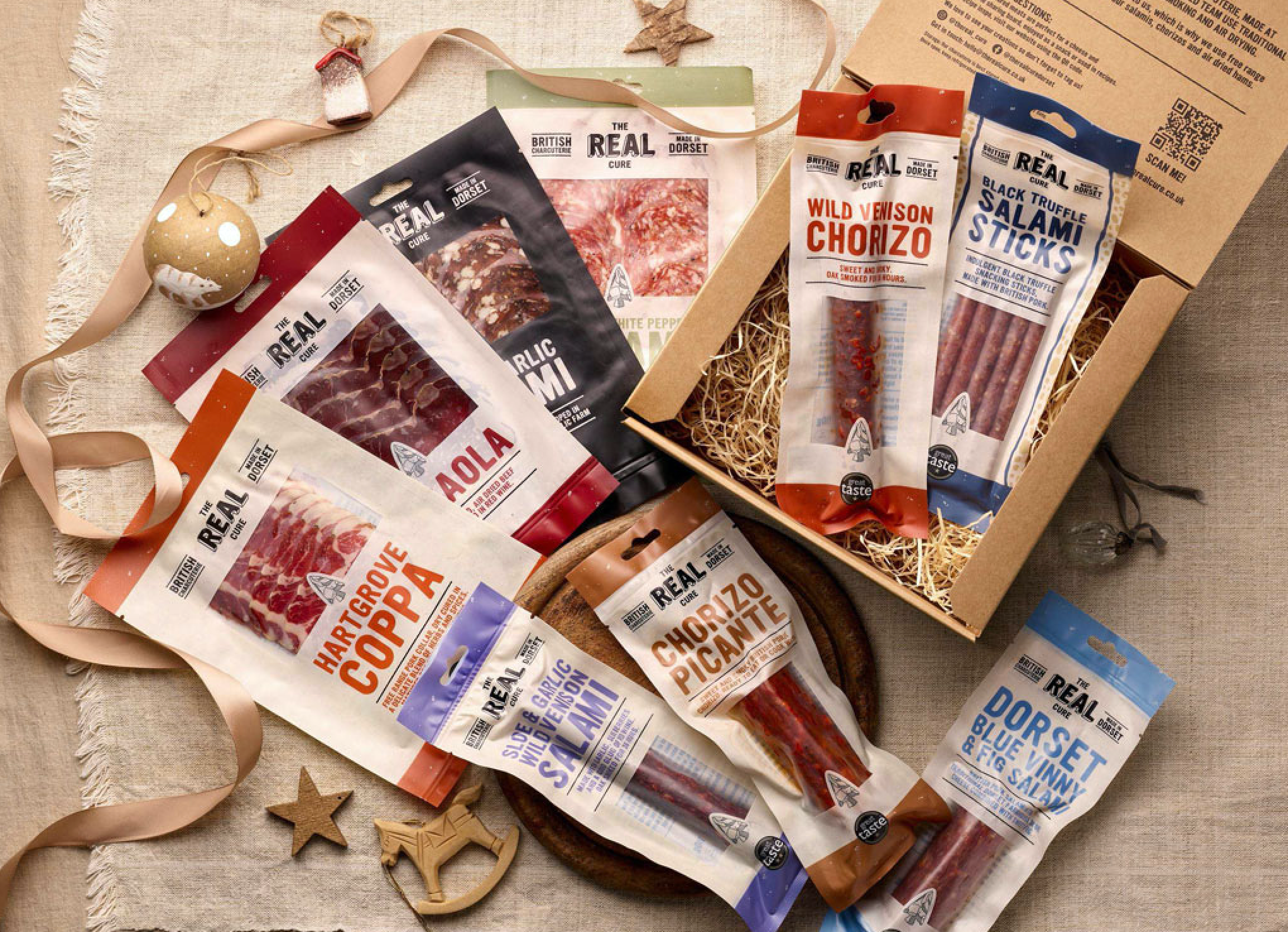 Selection of festive charcuterie on a christmas themed board